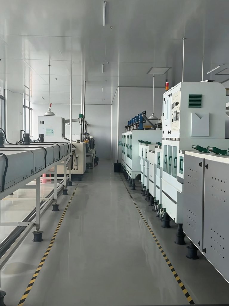 TMNetch automated etching and processing line with conveyor equipment inside clean industrial workshop